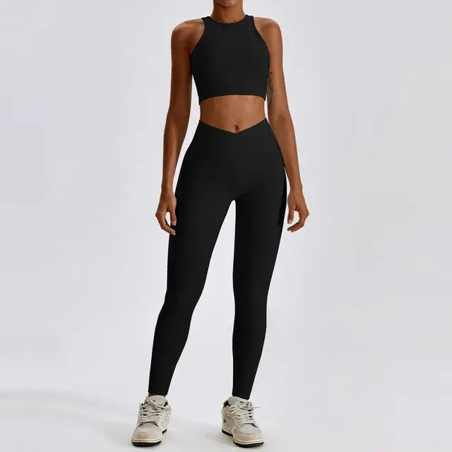 Stylish and comfortable women's two-piece fitness gym wear set featuring a matching sports bra and high-waisted leggings. Ideal for workouts, yoga, and casual wear, made from stretchy, moisture-wicking fabric