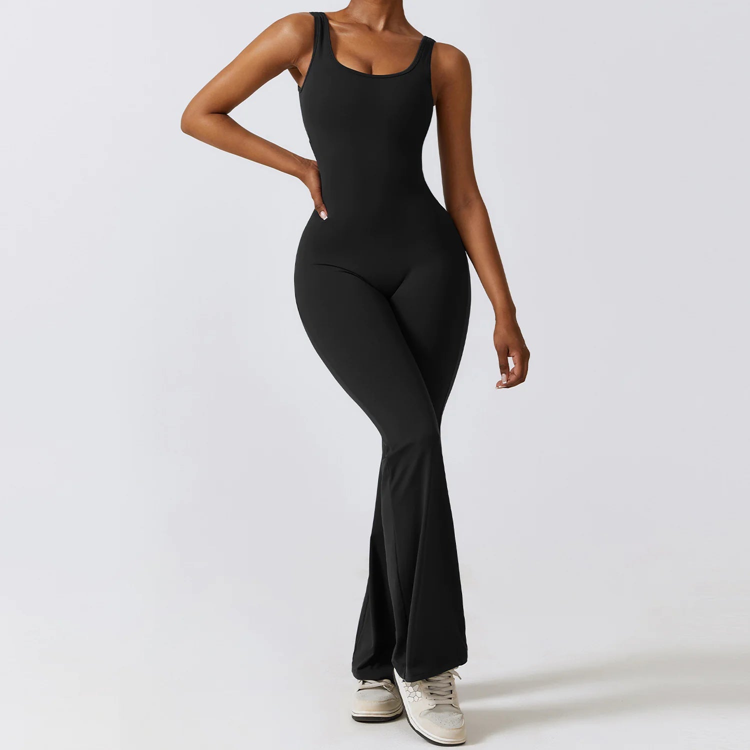 Women's back-out one-piece jumpsuit featuring a sleek, stylish open-back design. Crafted from a comfortable, stretchy material, this jumpsuit combines elegance and practicality, making it perfect for casual outings, workouts, or lounging in chic comfort.- TNT Fitness Gear