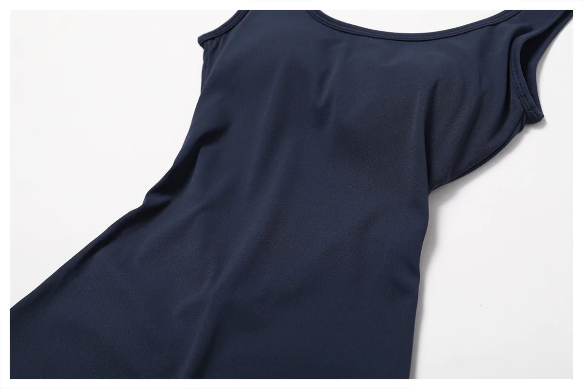 Women's back-out one-piece jumpsuit featuring a sleek, stylish open-back design. Crafted from a comfortable, stretchy material, this jumpsuit combines elegance and practicality, making it perfect for casual outings, workouts, or lounging in chic comfort.- TNT Fitness Gear