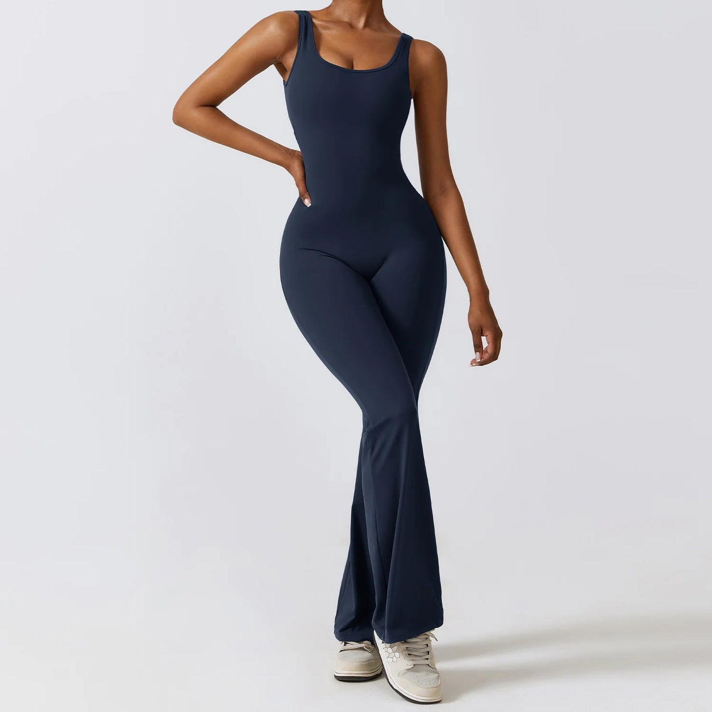 Women's back-out one-piece jumpsuit featuring a sleek, stylish open-back design. Crafted from a comfortable, stretchy material, this jumpsuit combines elegance and practicality, making it perfect for casual outings, workouts, or lounging in chic comfort.- TNT Fitness Gear