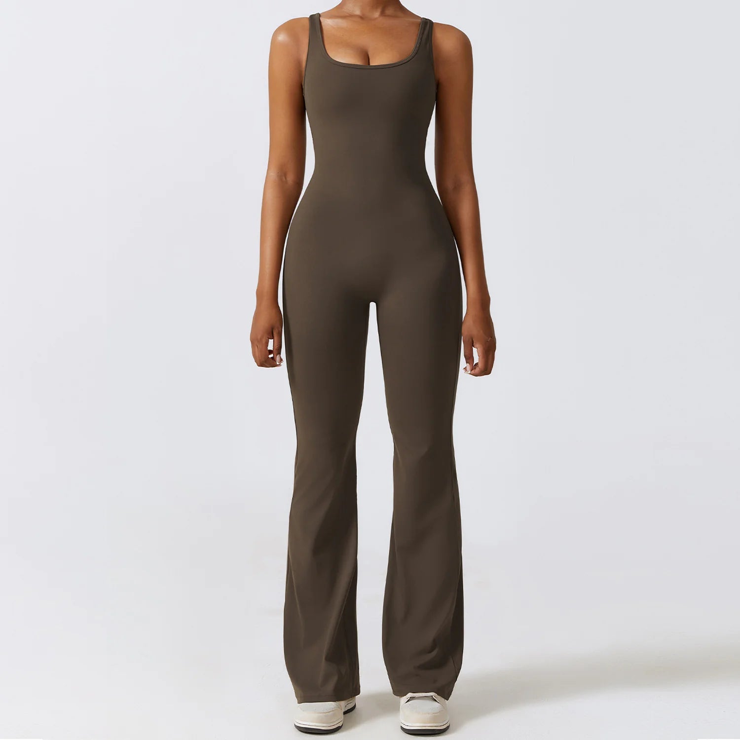 Women's back-out one-piece jumpsuit featuring a sleek, stylish open-back design. Crafted from a comfortable, stretchy material, this jumpsuit combines elegance and practicality, making it perfect for casual outings, workouts, or lounging in chic comfort.- TNT Fitness Gear