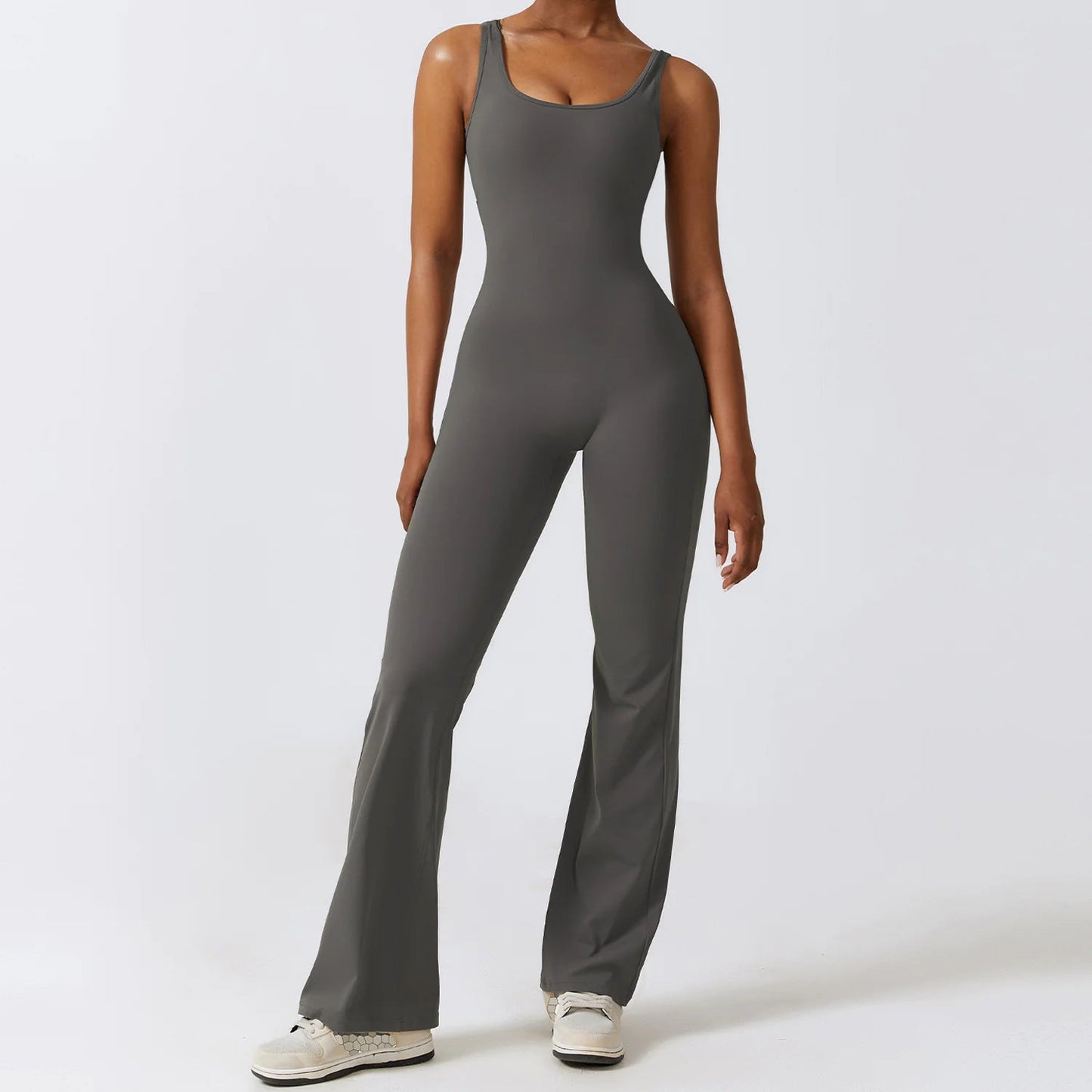 Women's back-out one-piece jumpsuit featuring a sleek, stylish open-back design. Crafted from a comfortable, stretchy material, this jumpsuit combines elegance and practicality, making it perfect for casual outings, workouts, or lounging in chic comfort.- TNT Fitness Gear