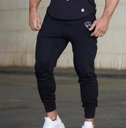 Bodybuilding Fitness Sweatpants - full-length, breathable cotton joggers with a mid-rise waist, loose fit, and adjustable drawstring. Designed for peak performance, stylish comfort, and unrestricted movement, perfect for gym sessions or daily wear - TNT Fitness Gear