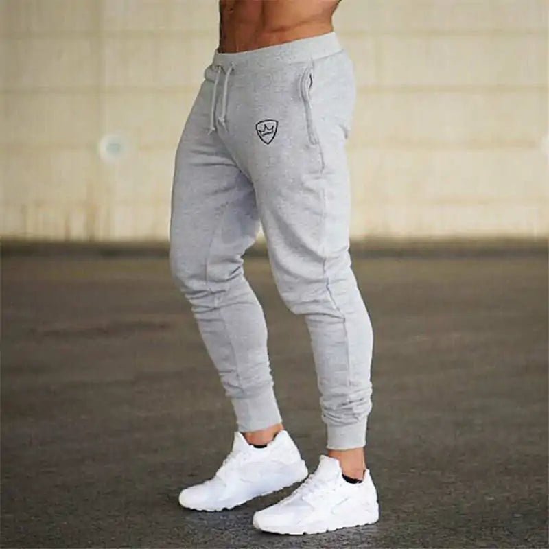 Bodybuilding Fitness Sweatpants - full-length, breathable cotton joggers with a mid-rise waist, loose fit, and adjustable drawstring. Designed for peak performance, stylish comfort, and unrestricted movement, perfect for gym sessions or daily wear - TNT Fitness Gear