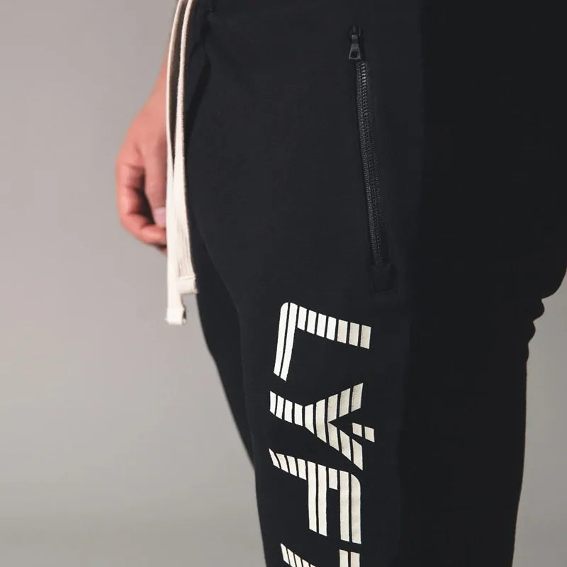 Men's Fitness Sweatpants - lightweight, breathable joggers with elastic waistband for comfort and tapered legs for a sleek look. Features moisture-wicking fabric and side pockets for essentials. Perfect for workouts or lounging. Available in stylish colors - TNT Fitness Gear