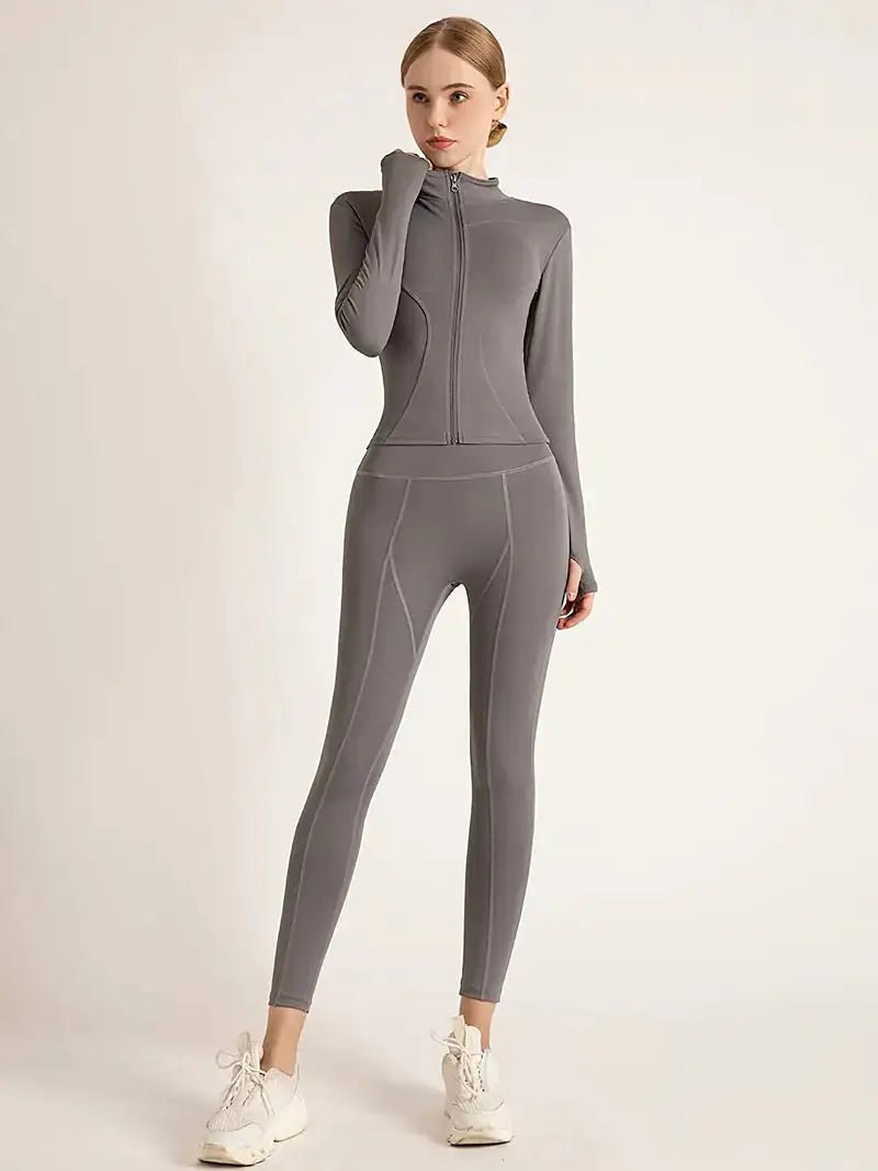 Women's lightweight zip-up yoga and workout jacket, designed for comfort and functionality. Made with breathable, stretchy fabric, this jacket offers a sleek fit and features a full zipper for easy layering. Perfect for yoga, workouts, or casual athleisure wear.- TNT Fitness Gear