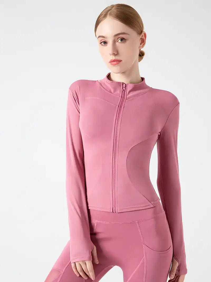 Women's lightweight zip-up yoga and workout jacket, designed for comfort and functionality. Made with breathable, stretchy fabric, this jacket offers a sleek fit and features a full zipper for easy layering. Perfect for yoga, workouts, or casual athleisure wear.- TNT Fitness Gear