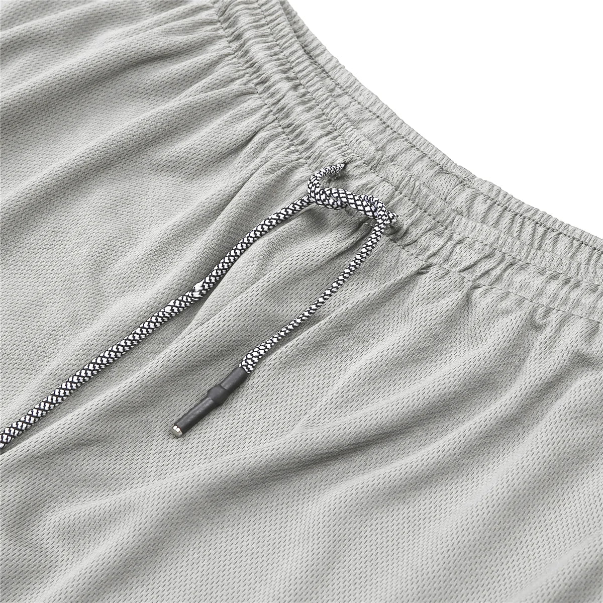 Fitness Running Shorts - lightweight, moisture-wicking shorts with flexible fabric for unrestricted movement. Features convenient pockets for essentials, ensuring cool, comfortable, and hassle-free runs - TNT Fitness Gear
