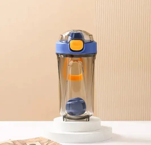 Fitness Shake Cup with a 32-ounce (950 ml) capacity, crafted from durable, BPA-free Tritan™ plastic. Features include a bounce cover for leak prevention, ergonomic non-slip grip, wide mouth for easy cleaning, integrated measurement markings, and a leak-proof seal. Portable, versatile, and dishwasher-safe, available in various colors.- TNT Fitness Gear