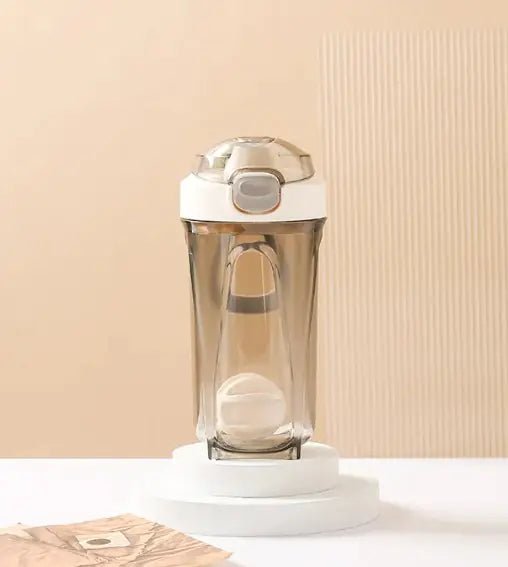 Fitness Shake Cup with a 32-ounce (950 ml) capacity, crafted from durable, BPA-free Tritan™ plastic. Features include a bounce cover for leak prevention, ergonomic non-slip grip, wide mouth for easy cleaning, integrated measurement markings, and a leak-proof seal. Portable, versatile, and dishwasher-safe, available in various colors.- TNT Fitness Gear