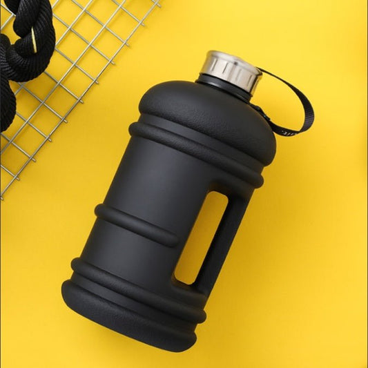 1.3L large-capacity fitness water bottle with a measurement scale for tracking hydration. Durable, lightweight, and designed for fitness enthusiasts, perfect for workouts, outdoor activities, or daily hydration needs -TNT Fitness Gear
