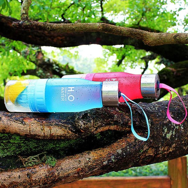 Fruit infusion water bottle designed for refreshing hydration, featuring a leak-proof design and built-in infuser to create healthy, flavorful drinks with fruits and herbs. Durable, eco-friendly, and perfect for on-the-go use, from the gym to outdoor adventures.- TNT Fitness