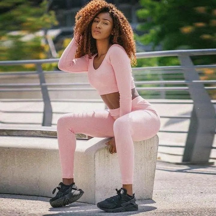 Women's Hyper Fit 2-piece workout set featuring a fitted top and matching bottoms. Designed with stretchable and moisture-wicking fabric for enhanced performance and comfort. A sleek and stylish outfit ideal for fitness activities, yoga, or casual athleisure wear - TNT Fitness Gear