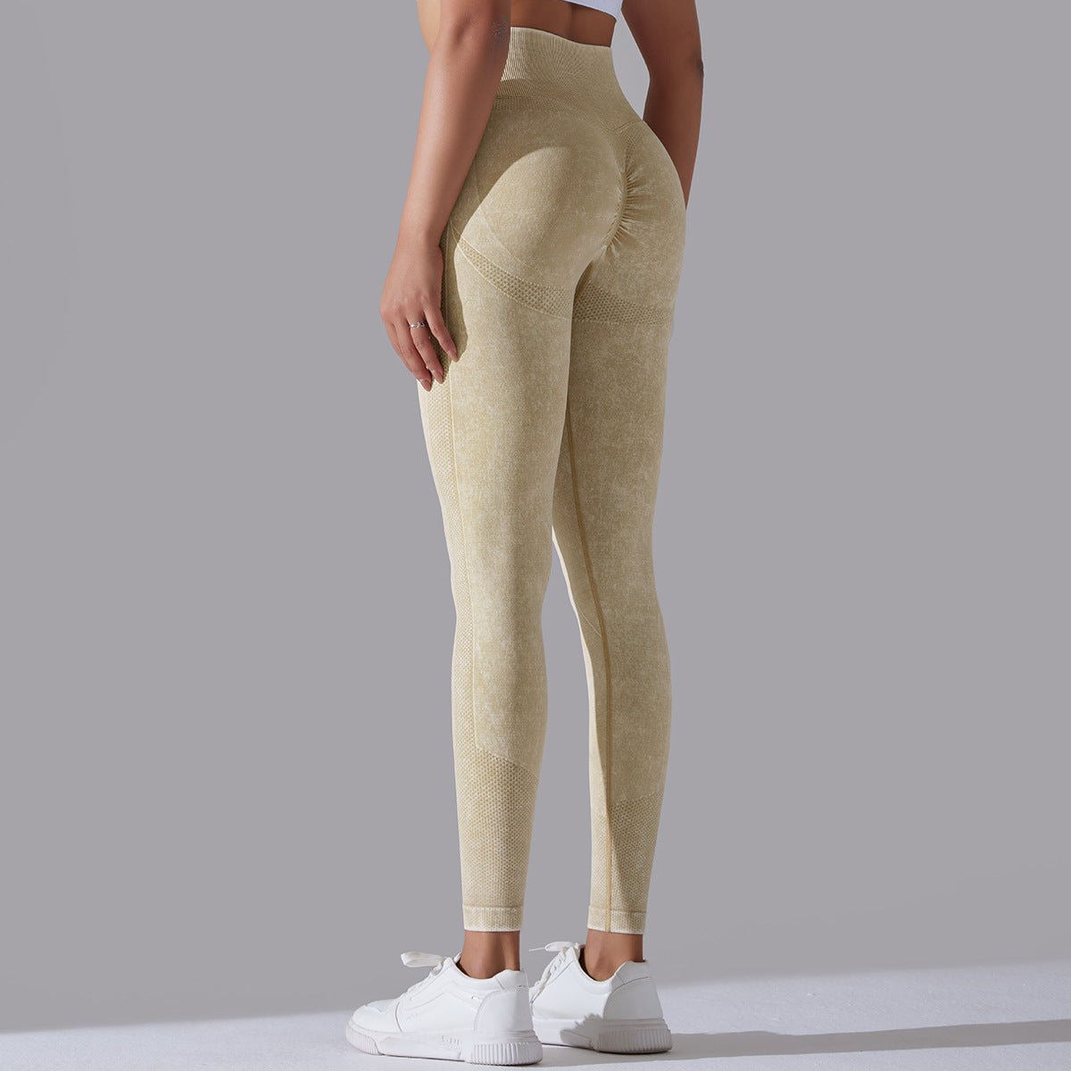 Seamless knitted high-waisted yoga pants designed for running and fitness, featuring a figure-flattering, butt-lifting design in a stretchy, breathable material for maximum comfort and style during workouts.- TNT Fitness Gear