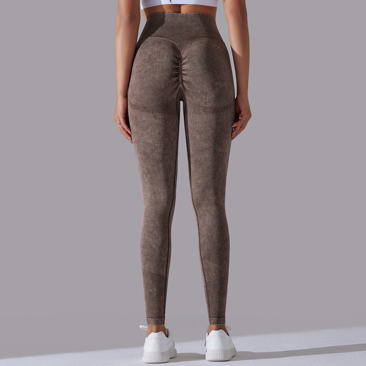 Seamless knitted high-waisted yoga pants designed for running and fitness, featuring a figure-flattering, butt-lifting design in a stretchy, breathable material for maximum comfort and style during workouts.- TNT Fitness Gear