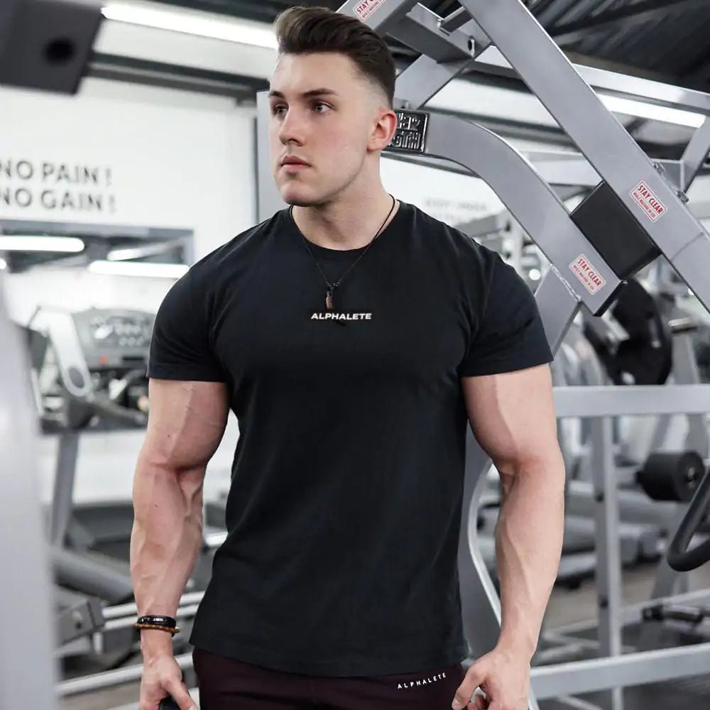 Men's Fitted Gym T-Shirt: Premium 100% cotton T-shirt with a breathable, moisture-wicking design and a flattering slim fit, ideal for gym workouts, running, or casual wear. TNT Fitness Gear