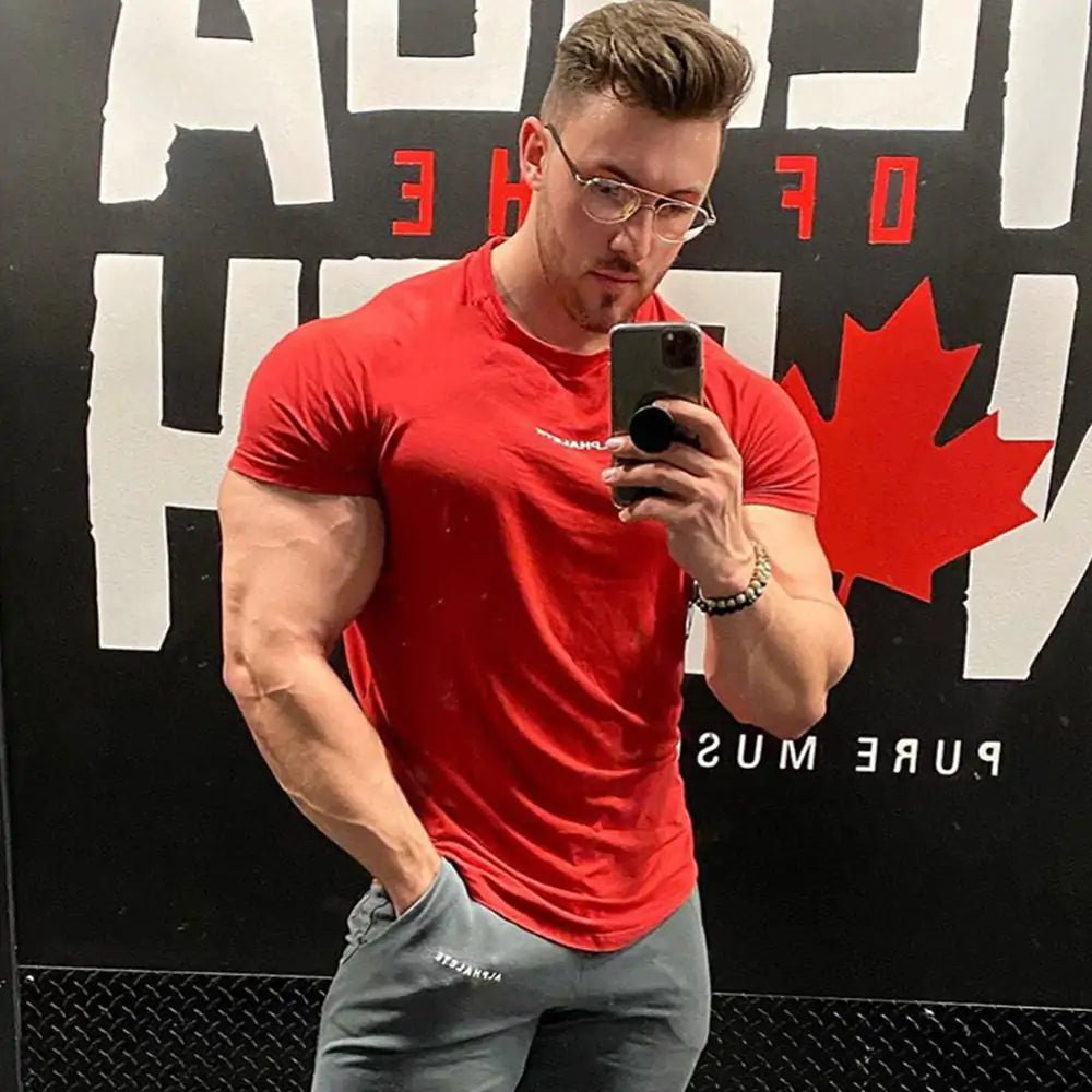 Men's Fitted Gym T-Shirt: Premium 100% cotton T-shirt with a breathable, moisture-wicking design and a flattering slim fit, ideal for gym workouts, running, or casual wear. TNT Fitness Gear