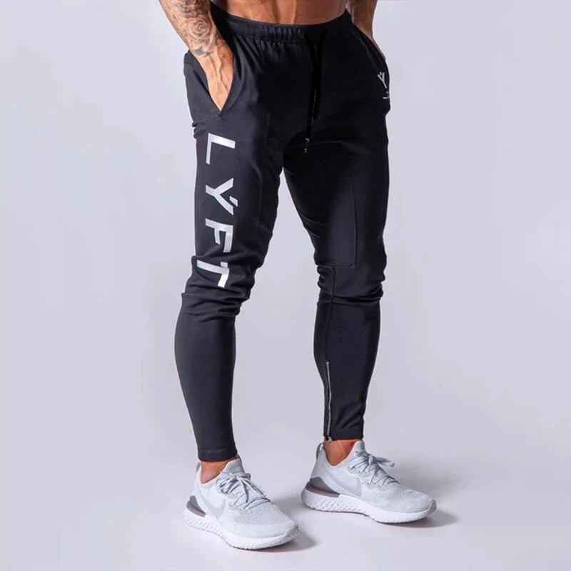 Men's Fitness Sweatpants - lightweight, breathable joggers with elastic waistband for comfort and tapered legs for a sleek look. Features moisture-wicking fabric and side pockets for essentials. Perfect for workouts or lounging. Available in stylish colors - TNT Fitness Gear