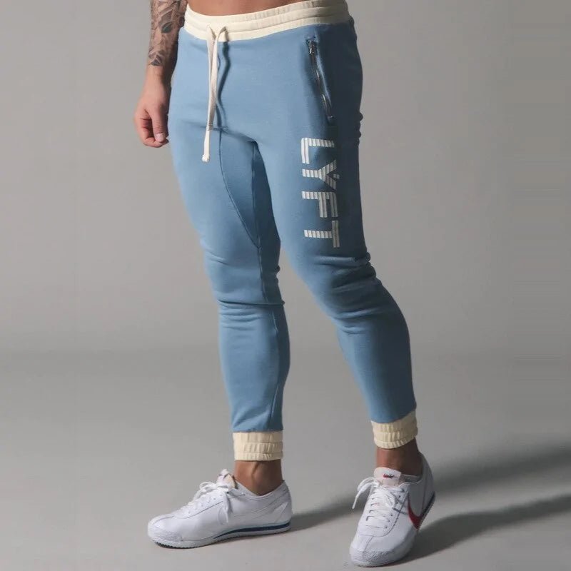 Men's Fitness Sweatpants - lightweight, breathable joggers with elastic waistband for comfort and tapered legs for a sleek look. Features moisture-wicking fabric and side pockets for essentials. Perfect for workouts or lounging. Available in stylish colors - TNT Fitness Gear