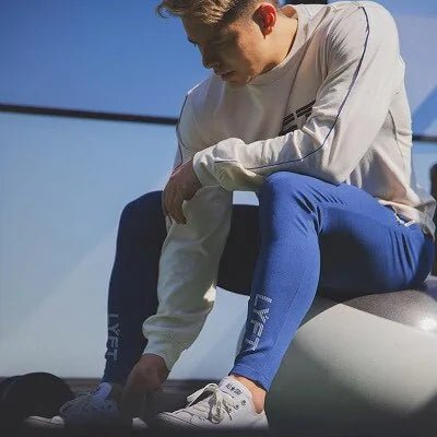 Men's Fitness Sweatpants - lightweight, breathable joggers with elastic waistband for comfort and tapered legs for a sleek look. Features moisture-wicking fabric and side pockets for essentials. Perfect for workouts or lounging. Available in stylish colors - TNT Fitness Gear