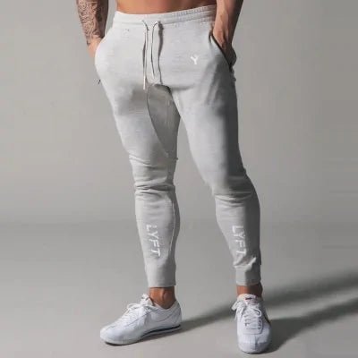 Men's Fitness Sweatpants - lightweight, breathable joggers with elastic waistband for comfort and tapered legs for a sleek look. Features moisture-wicking fabric and side pockets for essentials. Perfect for workouts or lounging. Available in stylish colors - TNT Fitness Gear