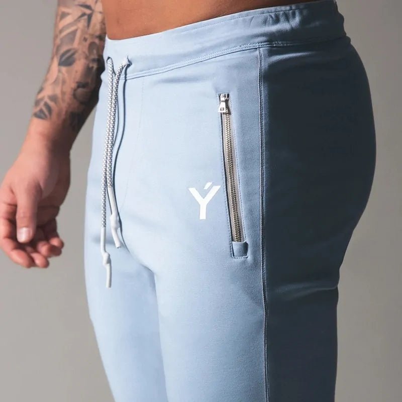 Men's Fitness Sweatpants - lightweight, breathable joggers with elastic waistband for comfort and tapered legs for a sleek look. Features moisture-wicking fabric and side pockets for essentials. Perfect for workouts or lounging. Available in stylish colors - TNT Fitness Gear