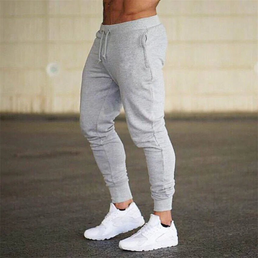 Premium men's athletic sweatpants with elastic waist and sleek design. Perfect for comfort and style by TNT Fitness Gear