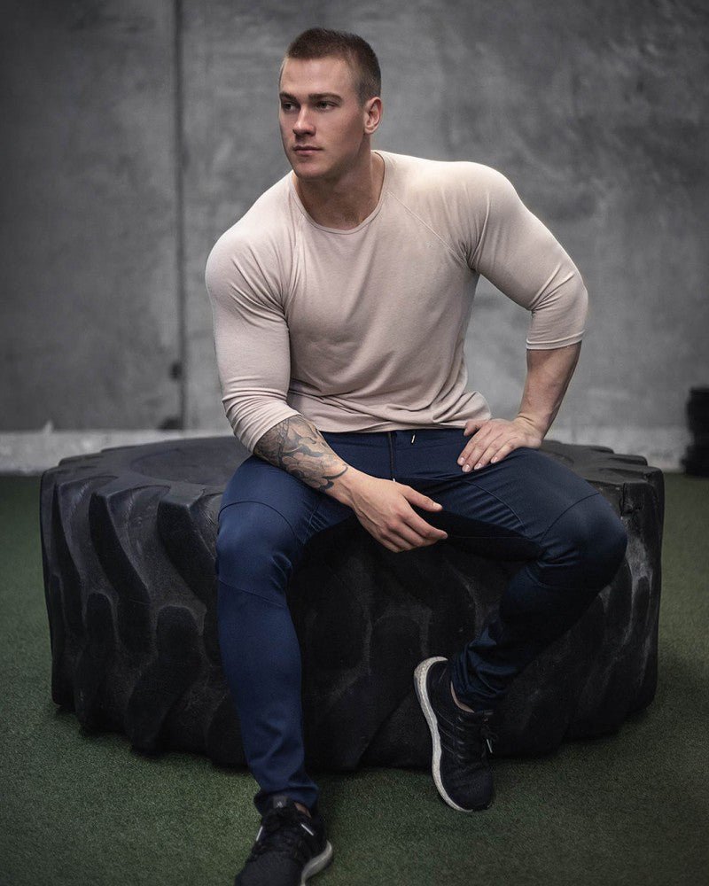 Men's quick-dry long sleeve gym shirt for fitness, running, and bodybuilding. Perfect workout gear by TNT Fitness Gear
