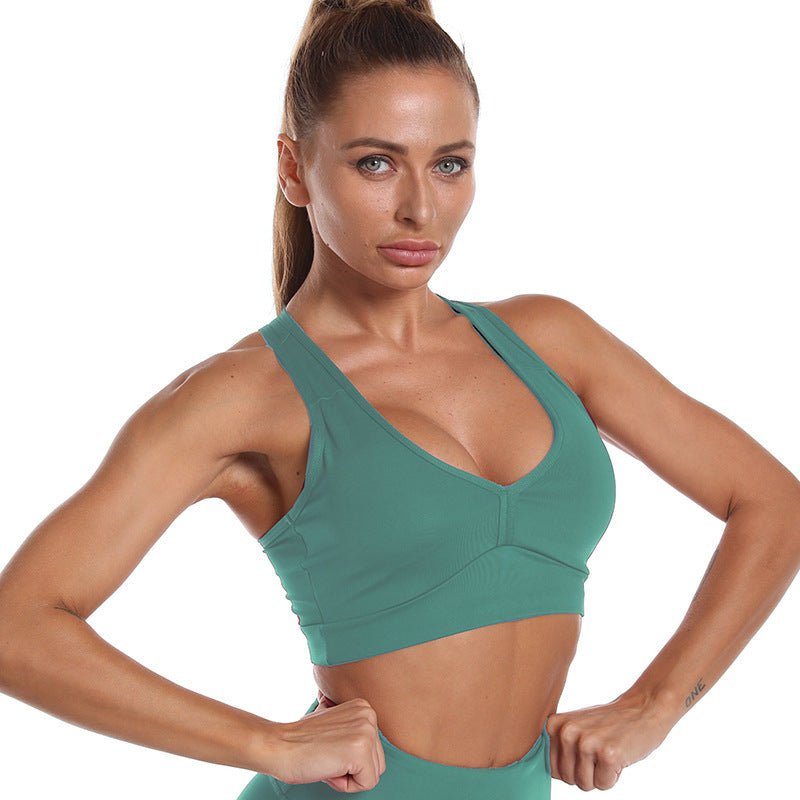 Women's 3-piece fitness and yoga set featuring a short top, a supportive sports bra, and butt lift pants. Designed with breathable, stretchable materials for optimal comfort and performance. A versatile and stylish ensemble suitable for workouts, yoga sessions, or casual athleisure wear.- TNT Fitness Gear