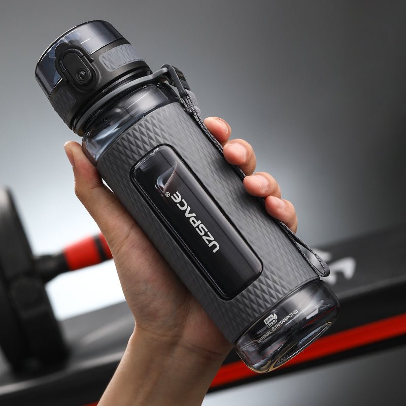 Portable sport water bottles made from durable copolymer polyester plastic, designed for active lifestyles. Lightweight and reliable with a temperature range of -10°C to 96°C, available in stylish colors and sizes (350ml, 450ml, 700ml, 950ml). Features include a leak-proof cap and easy spout for effortless hydration during any adventure. - TNT Fitness