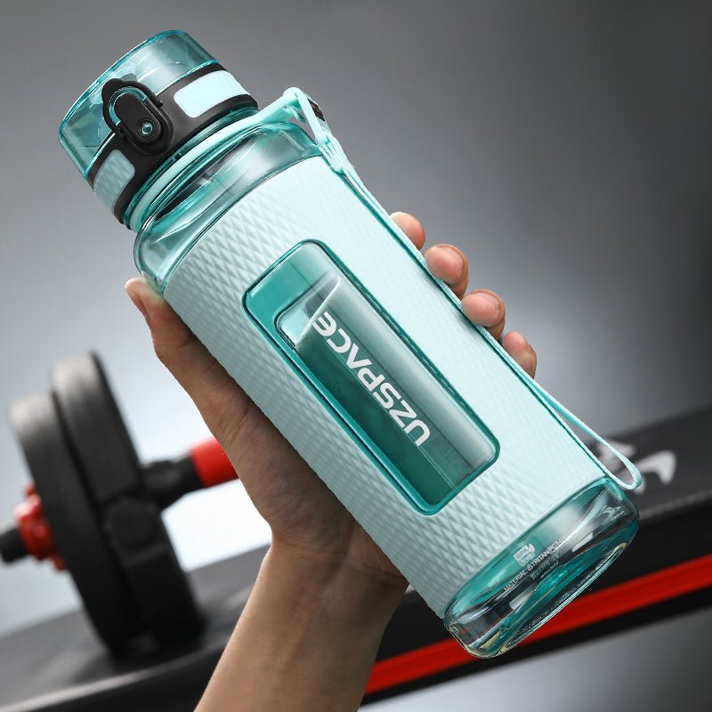Portable sport water bottles made from durable copolymer polyester plastic, designed for active lifestyles. Lightweight and reliable with a temperature range of -10°C to 96°C, available in stylish colors and sizes (350ml, 450ml, 700ml, 950ml). Features include a leak-proof cap and easy spout for effortless hydration during any adventure. - TNT Fitness