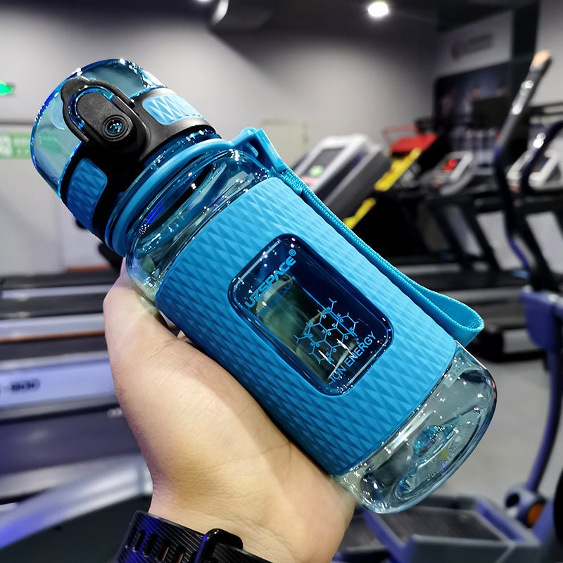 Portable sport water bottles made from durable copolymer polyester plastic, designed for active lifestyles. Lightweight and reliable with a temperature range of -10°C to 96°C, available in stylish colors and sizes (350ml, 450ml, 700ml, 950ml). Features include a leak-proof cap and easy spout for effortless hydration during any adventure. - TNT Fitness
