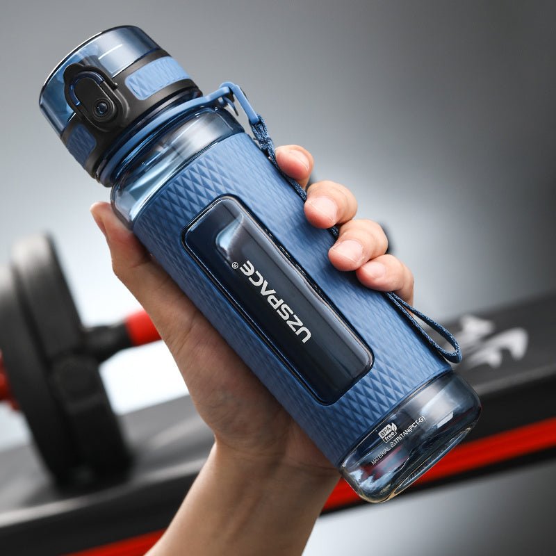 Portable sport water bottles made from durable copolymer polyester plastic, designed for active lifestyles. Lightweight and reliable with a temperature range of -10°C to 96°C, available in stylish colors and sizes (350ml, 450ml, 700ml, 950ml). Features include a leak-proof cap and easy spout for effortless hydration during any adventure. - TNT Fitness