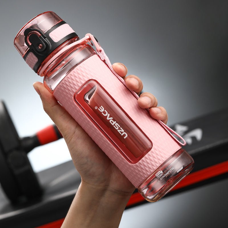 Portable sport water bottles made from durable copolymer polyester plastic, designed for active lifestyles. Lightweight and reliable with a temperature range of -10°C to 96°C, available in stylish colors and sizes (350ml, 450ml, 700ml, 950ml). Features include a leak-proof cap and easy spout for effortless hydration during any adventure. - TNT Fitness