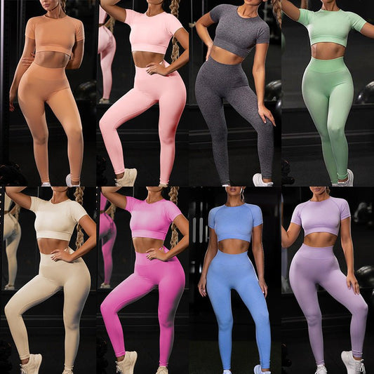 Women's seamless yoga set with short-sleeve top & trousers, in breathable nylon-spandex. Solid colors: hemp grey, pink, sky blue, orange, green, purple & red. By TNT Fitness Gear. Perfect for workouts