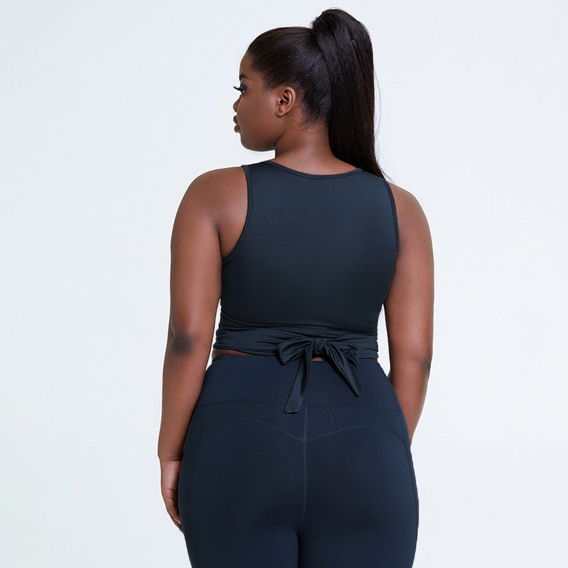 Breathable plus-size shockproof gym top with supportive chest pad design, adjustable straps, and stylish dark gray finish, perfect for yoga and fitness.- TNT Fitness Gear