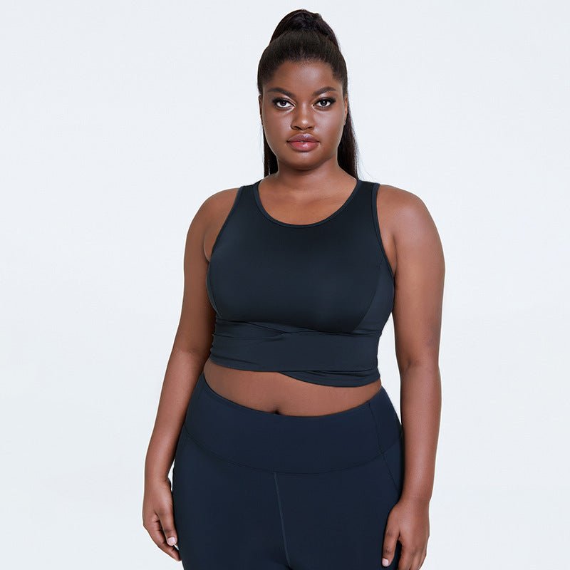 Breathable plus-size shockproof gym top with supportive chest pad design, adjustable straps, and stylish dark gray finish, perfect for yoga and fitness.- TNT Fitness Gear