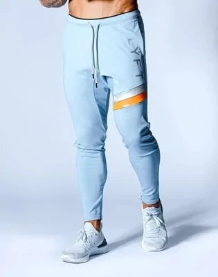 Men's Fitness Sweatpants - lightweight, breathable joggers with elastic waistband for comfort and tapered legs for a sleek look. Features moisture-wicking fabric and side pockets for essentials. Perfect for workouts or lounging. Available in stylish colors - TNT Fitness Gear