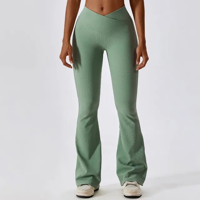 Flared fitness pants for women, designed for gym workouts and yoga. Made with stretchy, breathable material for comfort and freedom of movement. Features a flattering flared silhouette, ideal for both active and casual wear - TNT Fitness Gear