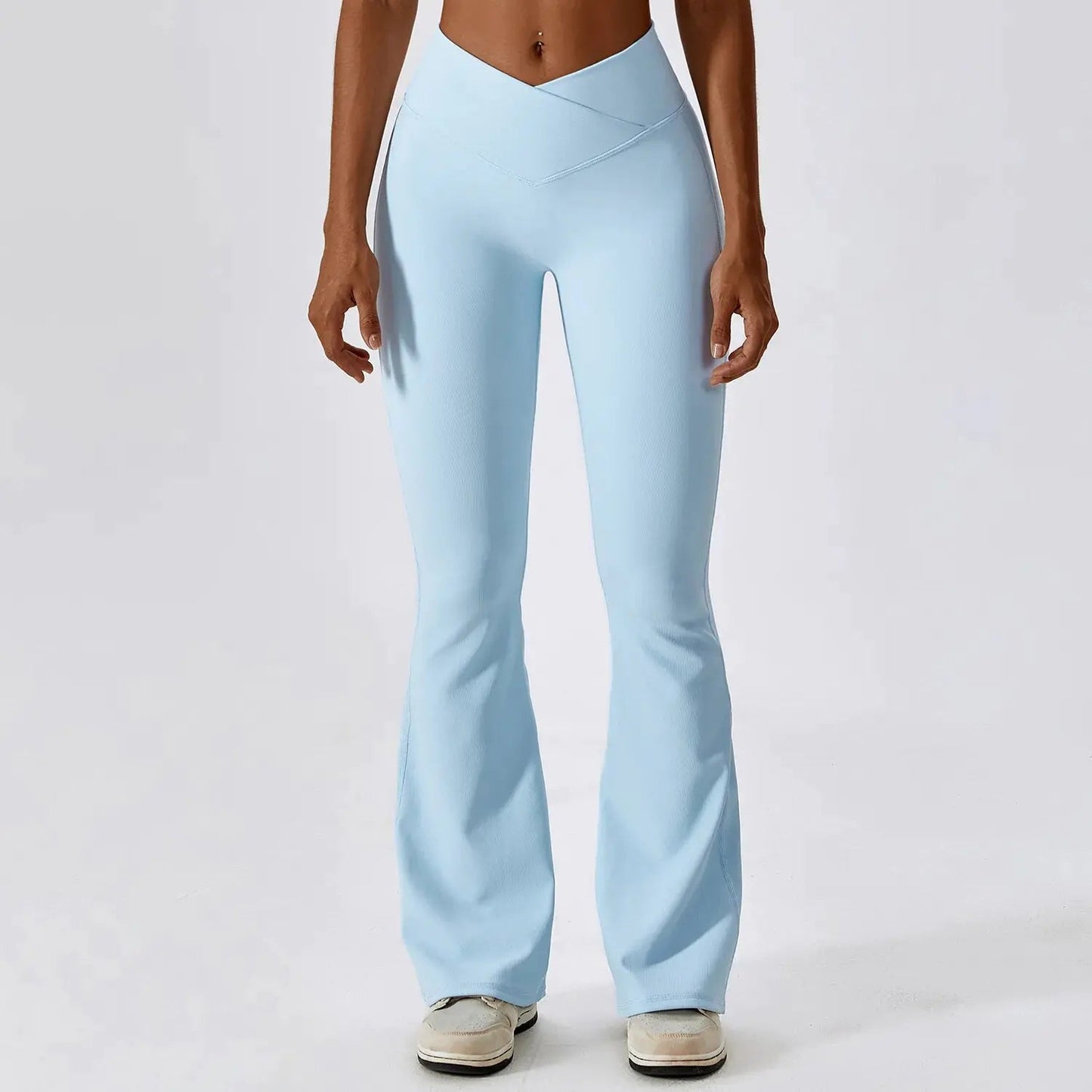 Flared fitness pants for women, designed for gym workouts and yoga. Made with stretchy, breathable material for comfort and freedom of movement. Features a flattering flared silhouette, ideal for both active and casual wear - TNT Fitness Gear
