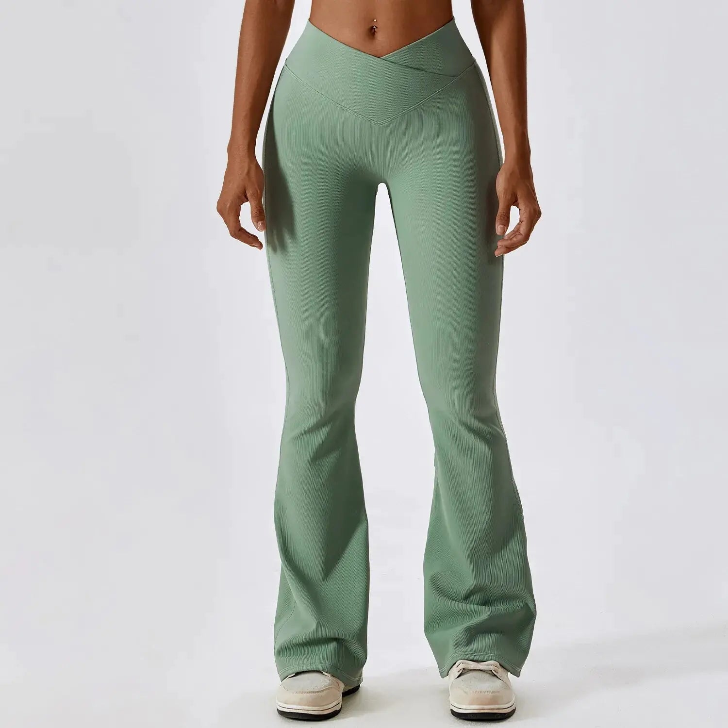Flared fitness pants for women, designed for gym workouts and yoga. Made with stretchy, breathable material for comfort and freedom of movement. Features a flattering flared silhouette, ideal for both active and casual wear - TNT Fitness Gear