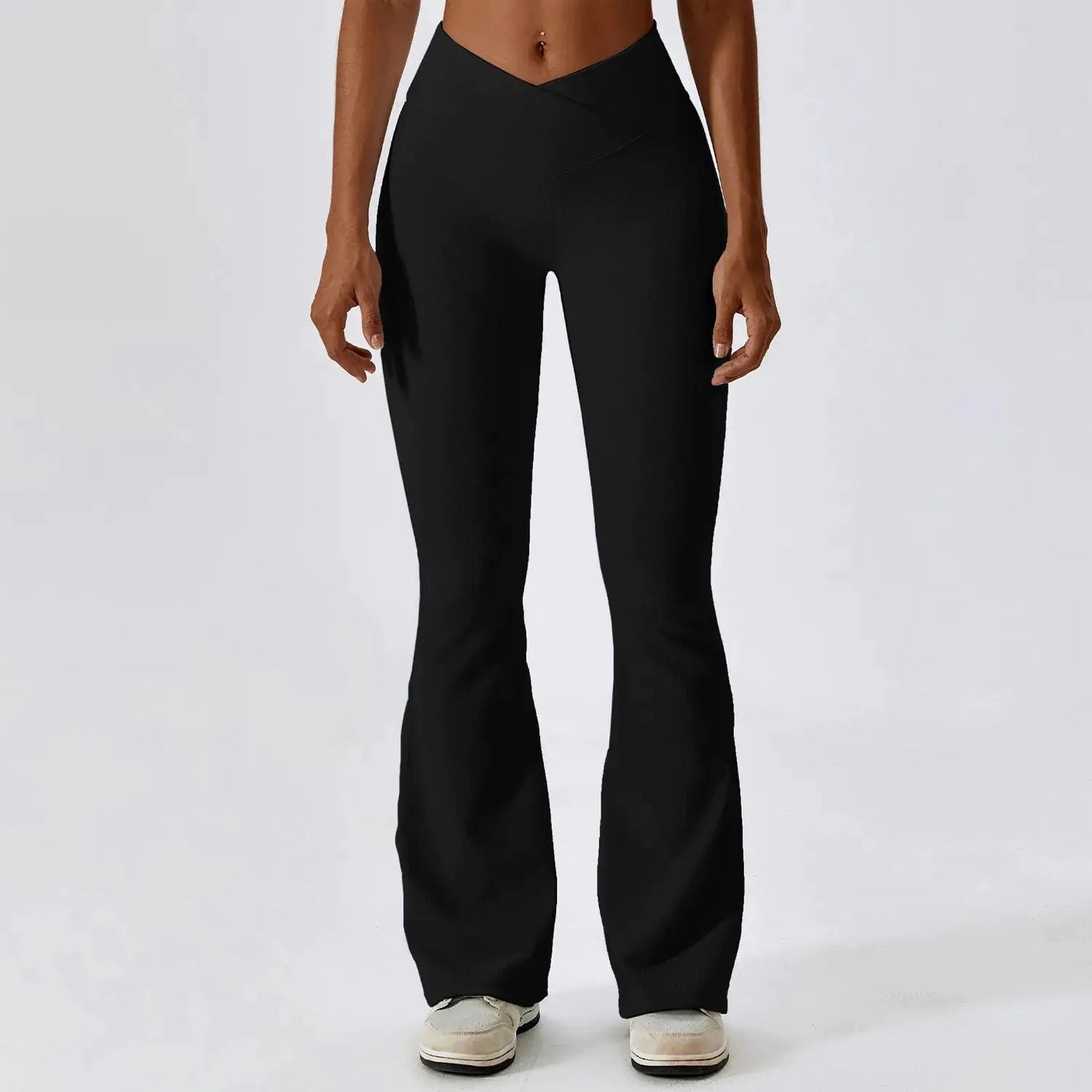 Flared fitness pants for women, designed for gym workouts and yoga. Made with stretchy, breathable material for comfort and freedom of movement. Features a flattering flared silhouette, ideal for both active and casual wear - TNT Fitness Gear