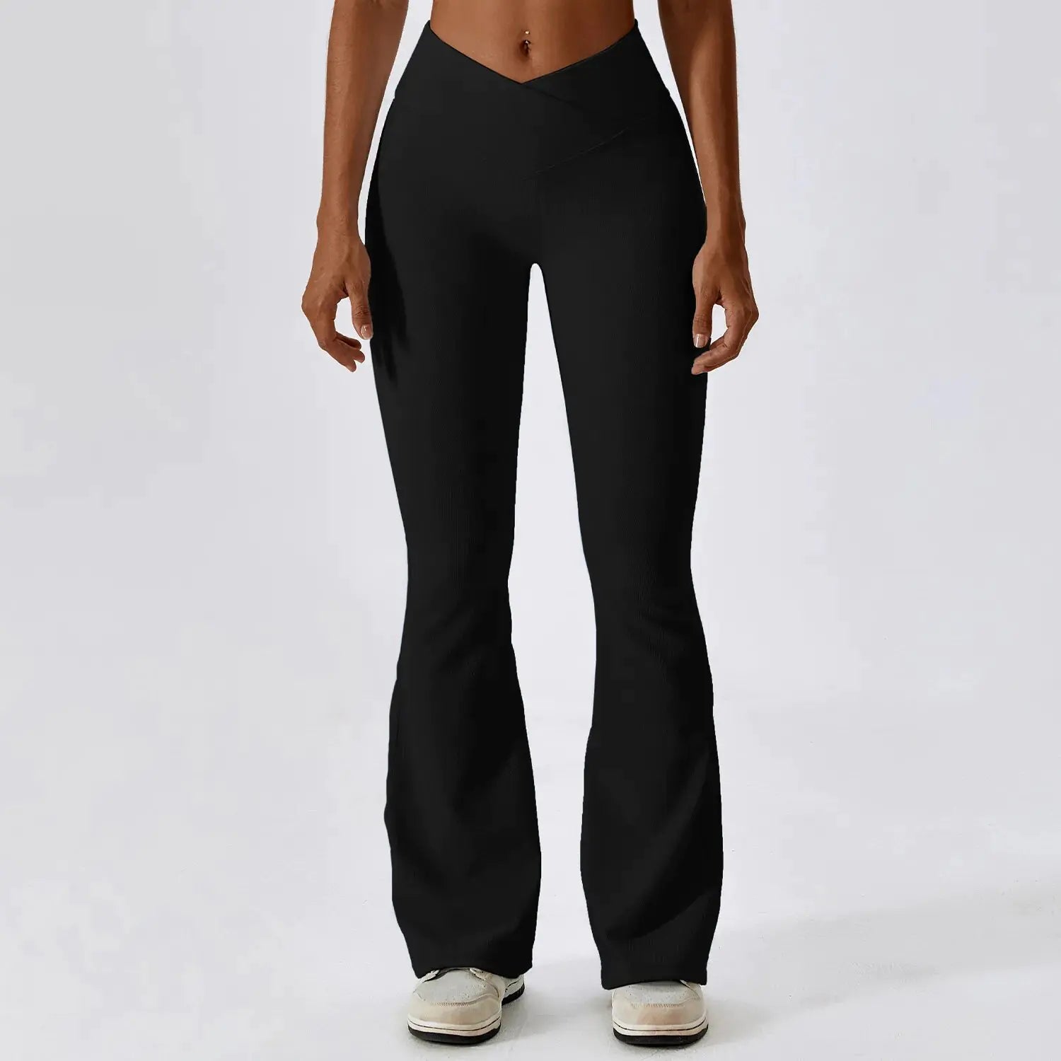 Flared fitness pants for women, designed for gym workouts and yoga. Made with stretchy, breathable material for comfort and freedom of movement. Features a flattering flared silhouette, ideal for both active and casual wear - TNT Fitness Gear