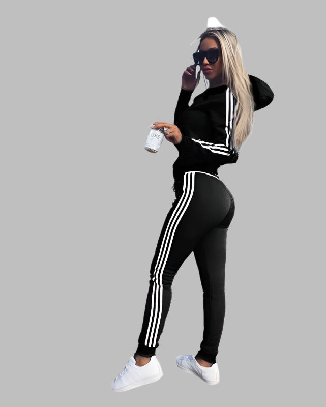 Women's sports and leisure suit featuring a stylish hood, designed for comfort and practicality. The suit showcases a relaxed fit with breathable fabric, complete with a cozy hood for added versatility. Ideal for casual outings, light workouts, or lounging in style - TNT Fitness Gear