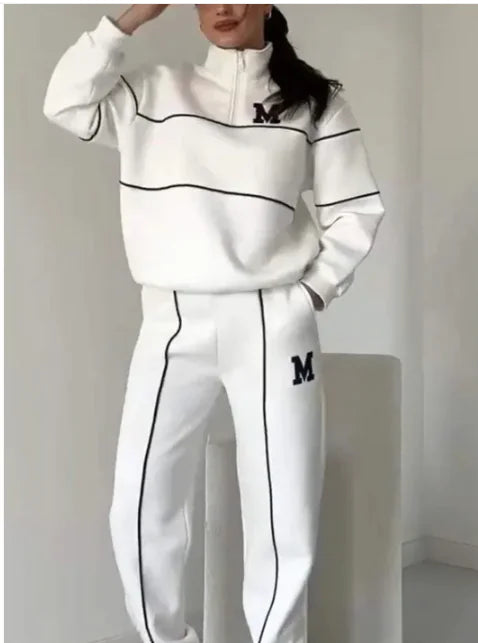 Women's 2-piece lounge set with pullover sweatshirt and sweatpants. Comfortable, stylish, and pocketed by TNT Fitness Gear