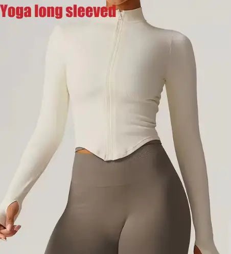 Women's zippered fitness crop top designed for style and functionality. Featuring a sleek zipper detail and a flattering cropped fit, this top is made from breathable, stretchy fabric for comfort and flexibility. Ideal for workouts, yoga, or trendy athleisure wear - TNT Fitness