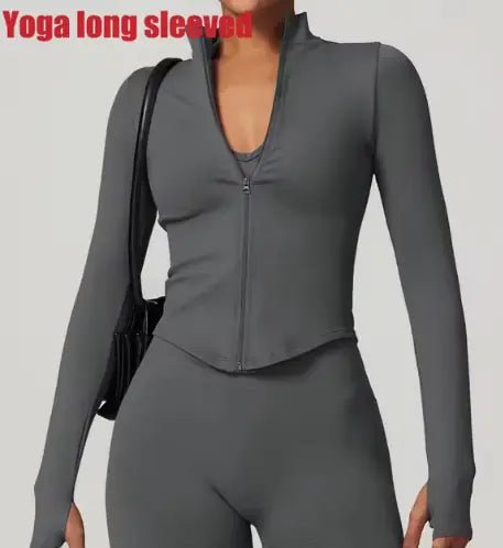 Women's zippered fitness crop top designed for style and functionality. Featuring a sleek zipper detail and a flattering cropped fit, this top is made from breathable, stretchy fabric for comfort and flexibility. Ideal for workouts, yoga, or trendy athleisure wear - TNT Fitness
