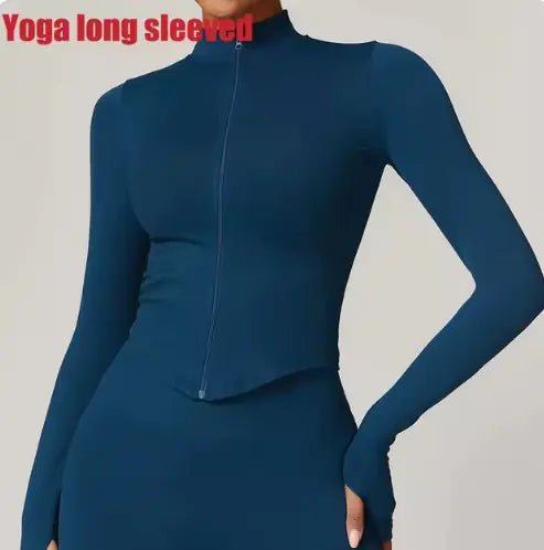 Women's zippered fitness crop top designed for style and functionality. Featuring a sleek zipper detail and a flattering cropped fit, this top is made from breathable, stretchy fabric for comfort and flexibility. Ideal for workouts, yoga, or trendy athleisure wear - TNT Fitness