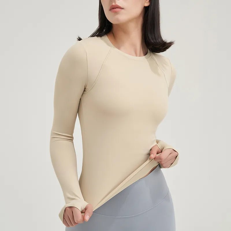 Women's yoga shirt designed for ultimate comfort and style. Made from high-quality, breathable, moisture-wicking fabric, it ensures flexibility and support for yoga and fitness sessions. Featuring a flattering design and vibrant colors, this versatile shirt keeps you cool, confident, and stylish during workouts - TNT Fitness Gear