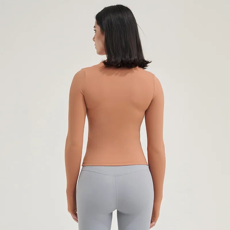 Woman wearing long sleeve training top during workout session